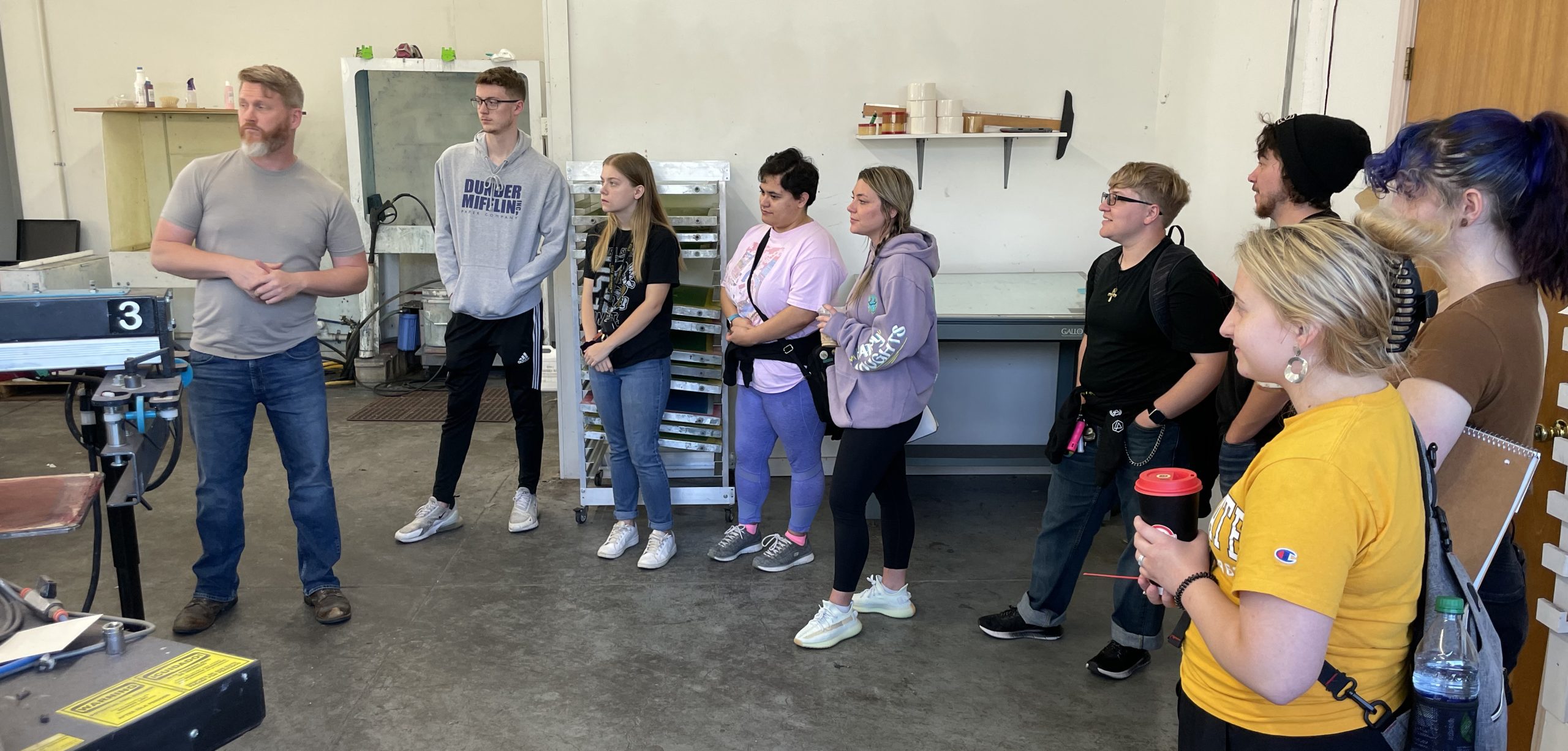 Students standing in the Uncommon Threads studio on a tour.